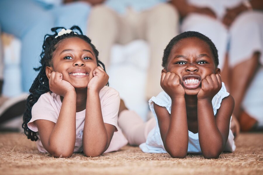 relax-girls-portrait-happy-kids-floor-carpet-mat-bonding-playing-family-home-together-funny-children-faces-african-children-siblings-love-resting-enjoying-holiday_590464-210712